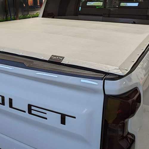 White Snap-on tonneau cover